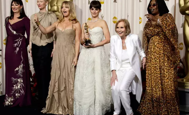 FILE - Penelope Cruz, fourth from left, holds the Oscar for best supporting actress for her work in, "Vicky Cristina Barcelona," during the 81st Academy Awards, Feb. 22, 2009, in Los Angeles. She is joined by past supporting actress winners from left, Anjelica Huston, Tilda Swinton, Goldie Hawn, second from right Eva Marie Saint, and Whoopi Goldberg, right. (AP Photo/Matt Sayles, File)