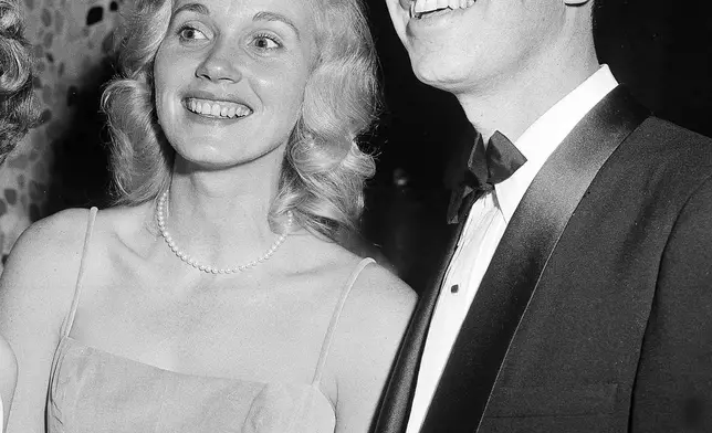 FILE - Eva Marie Saint, left, and Jeffrey Hayden the annual Motion Picture Costumers ball on Oct. 25, 1957, in Los Angeles. (AP Photo/Harold P. Matosian, File)