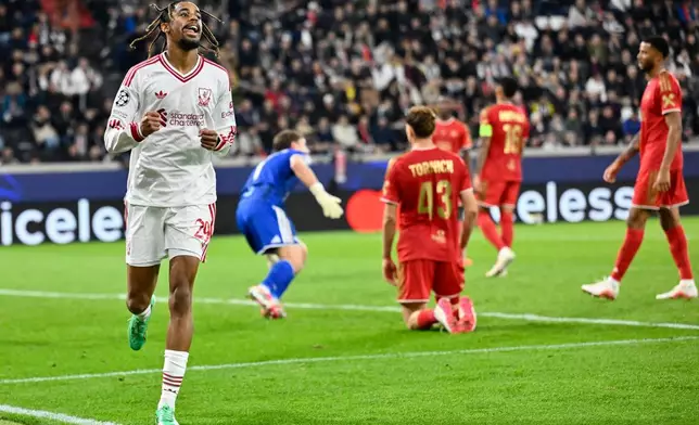 Liverpool's Bradley Barcola, left, celebrates after scoring his side's third goal during the Champions League opening phase soccer match between LASK and Liverpool in Linz, Austria, Wednesday, Oct. 14, 2026. (AP Photo/Denes Erdos)