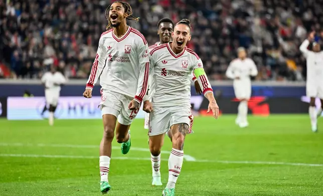 Liverpool's Bradley Barcola, left, celebrates after scoring his side's second goal during the Champions League opening phase soccer match between LASK and Liverpool in Linz, Austria, Wednesday, Oct. 14, 2026. (AP Photo/Denes Erdos)