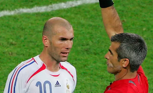 FILE - France's Zinedine Zidane gets a red card from referee Horacio Elizondo of Argentina after head-butting Italy's Marco Materazzi in the chest during extra time in the final of the soccer World Cup between Italy and France in Berlin, July 9, 2006. (AP Photo/Michael Probst, File)
