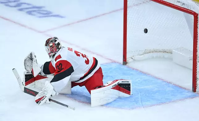 Carolina Hurricanes goalie Brandon Bussi misses a goal scored by Chicago Blackhawks' Roman Kantserov during the second period of an NHL hockey game Saturday, Oct. 10, 2026, in Chicago. (AP Photo/Paul Beaty)