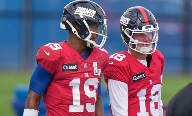 New York Giants' quarterbacks J.J. McCarthy, right, and Jameis Winston talk during a practice at the team's NFL football facilities in East Rutherford, N.J., Wednesday, Sept. 30, 2026. (AP Photo/Seth Wenig)