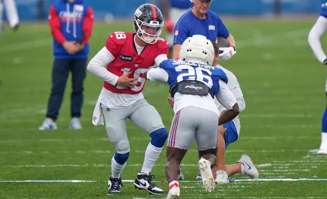 New York Giants' quarterback J.J. McCarthy (18) practices at the team's NFL football facilities in East Rutherford, N.J., Wednesday, Sept. 30, 2026. (AP Photo/Seth Wenig)