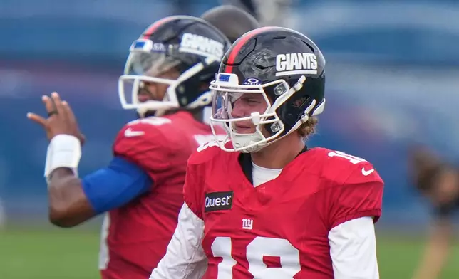 New York Giants' quarterback J.J. McCarthy, right, looks on as quarterback Jameis Winston, left, throws during a practice at the team's NFL football facilities in East Rutherford, N.J., Wednesday, Sept. 30, 2026. (AP Photo/Seth Wenig)