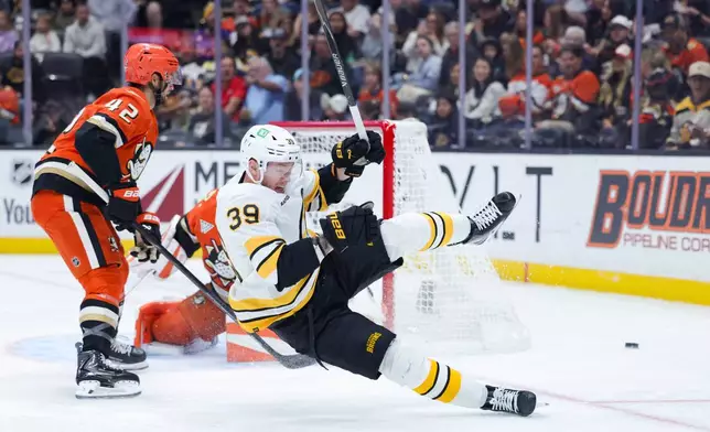 Boston Bruins center Morgan Geekie reacts after shooting during the first period of an NHL hockey game against the Anaheim Ducks Friday, Oct. 16, 2026 in Anaheim, Calif. (AP Photo/Ryan Sun)