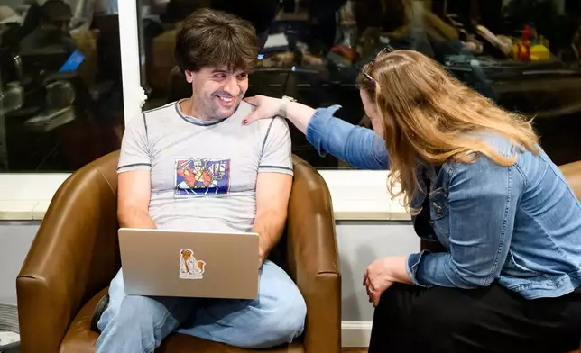 Karl Deisseroth, one of the three recipients of the 2026 Nobel Prize in medicine, talks to his wife Michelle Monje-Deisseroth at home Monday, Oct. 5, 2026, in Stanford, Calif. (AP Photo/Noah Berger)