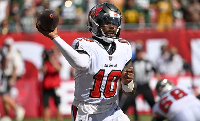 Tampa Bay Buccaneers quarterback Jalon Daniels (10) aims a pass during the second half of an NFL football game against the Green Bay Packers in Tampa, Fla., Sunday, Oct. 4, 2026. (AP Photo/Jason Behnken)