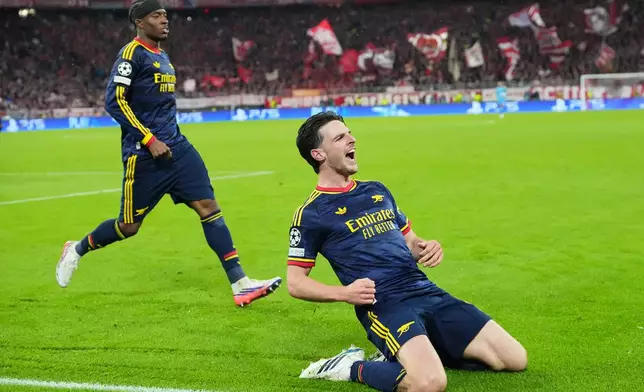 Arsenal's Declan Rice celebrates after scoring his side's second goal during the UEFA Champions League soccer match between Bayern Munich and Arsenal in Munich Germany, Wednesday, Oct. 21, 2026. (AP Photo/Martin Meissner)