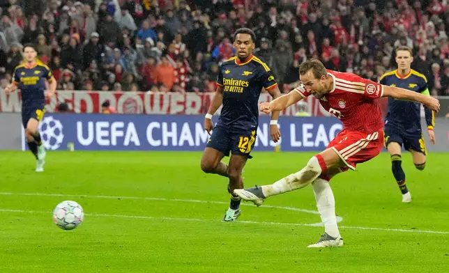 Bayern's Harry Kane shoots during the UEFA Champions League soccer match between Bayern and Arsenal in Munich Germany, Wednesday, Oct. 21, 2026. (AP Photo/Martin Meissner)