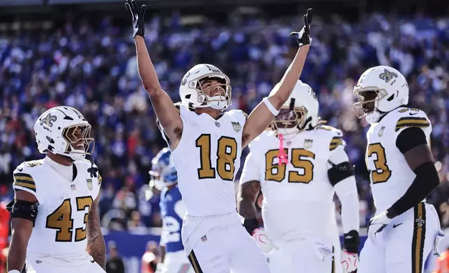 New Orleans Saints wide receiver Bryce Lance (18) celebrates a touchdown during the first half of an NFL football game against the New York Giants in East Rutherford, N.J., Sunday, Oct. 18, 2026. (AP Photo/Adam Hunger)