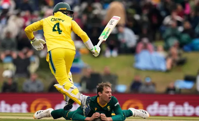 South Africa's Tristan Stubbs falls to the ground as runs are scored by Australia's Alex Carey, from his delivery during the third one day international cricket match between South Africa and Australia, in Potchefstroom, South Africa, Wednesday, Sept. 30, 2026. (AP Photo/Themba Hadebe)
