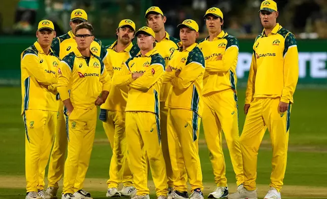 Australia's players watch a review on a big electronic screen during the third one day international cricket match between South Africa and Australia, in Potchefstroom, South Africa, Wednesday, Sept. 30, 2026. (AP Photo/Themba Hadebe)