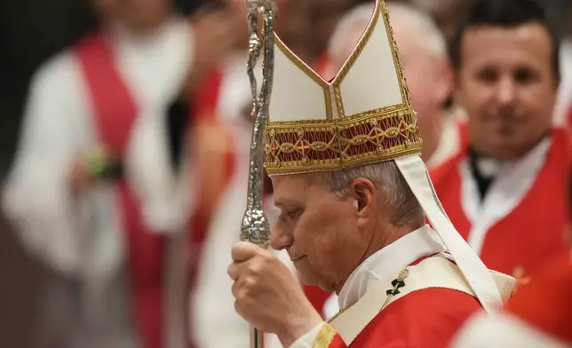 Pope Leo XIV arrives to celebrate a mass in St. Peter's Basilica at the Vatican, Thursday, Oct.8, 2026, for the annual opening of the academic year at pontifical universities, joining Rome's 22 pontifical institutions and numerous others worldwide. (AP Photo/Gregorio Borgia)