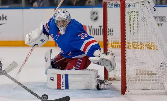 New York Rangers goaltender Dylan Garand defends the goal during the third period of an NHL hockey game against the Tampa Bay Lightning in New York, Tuesday, Oct. 13, 2026. (AP Photo/Seth Wenig)