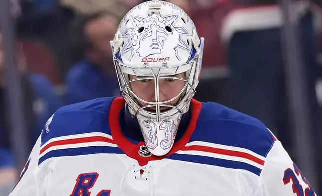 New York Rangers goalie Dylan Garand reacts after giving up a goal during the second period of an NHL hockey game against the New Jersey Devils, Thursday, Oct. 15, 2026, in Newark, N.J. (AP Photo/Adam Hunger)