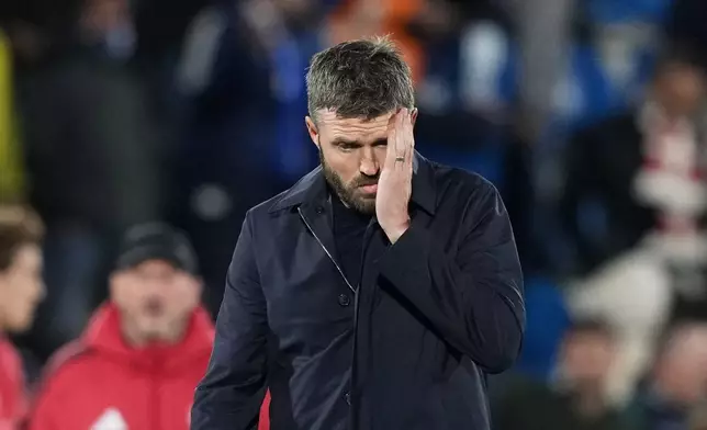 Manchester United's head coach Michael Carrick leaves the pitch after the Champions League opening phase soccer match between Como and Manchester United in Como, Italy, Wednesday, Oct. 21, 2026. (AP Photo/Antonio Calanni)