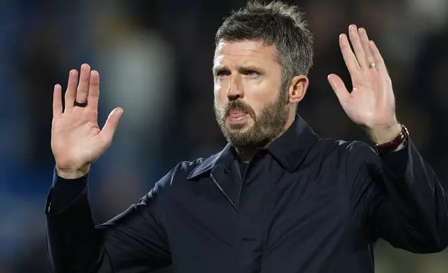 Manchester United's head coach Michael Carrick gestures as he leaves the pitch after the Champions League opening phase soccer match between Como and Manchester United in Como, Italy, Wednesday, Oct. 21, 2026. (AP Photo/Antonio Calanni)