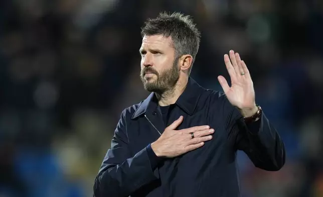 Manchester United's head coach Michael Carrick gestures as he leaves the pitch after the Champions League opening phase soccer match between Como and Manchester United in Como, Italy, Wednesday, Oct. 21, 2026. (AP Photo/Antonio Calanni)