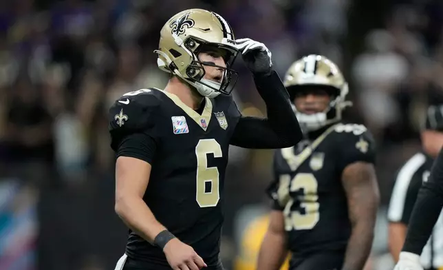 New Orleans Saints quarterback Tyler Shough (6) walks toward the sideline after throwing an incomplete pass during the second half of an NFL football game against the Minnesota Vikings in New Orleans, Sunday, Oct. 11, 2026. (AP Photo/Gerald Herbert)