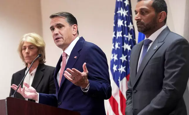 FBI Director Kash Patel, right, US Attorney General Todd Blanche, center, and Assistant US attorney Theophani Stamos, during a press conference announcing the indictment of Virginia State Sen. Louise Lucas, D-Portsmouth, Thursday Oct. 22, 2026, in Norfolk, Va. (AP Photo/Steve Helber)