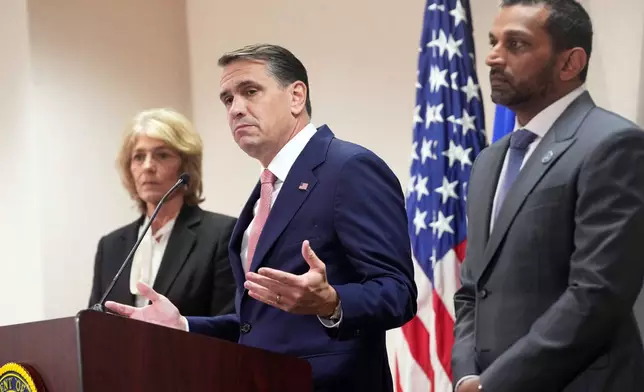 FBI Director Kash Patel, right, US Attorney General Todd Blanche, center, and Assistant US Attorney Theophani Stamos, during a press conference announcing the indictment of Virginia State Sen. Louise Lucas, D-Portsmouth, Thursday Oct. 22, 2026, in Norfolk, Va. (AP Photo/Steve Helber)