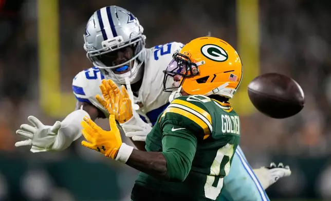 Dallas Cowboys' Joey Porter Jr. breaks up a pass intended for Green Bay Packers' Matthew Golden during the second half of an NFL football game in Green Bay, Wis., Sunday, Oct. 18, 2026. (AP Photo/Nam Huh)