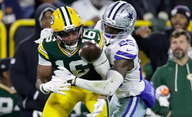 Dallas Cowboys' Joey Porter Jr. breaks up a pass intended for Green Bay Packers' Bo Melton during the first half of an NFL football game in Green Bay, Wis., Sunday, Oct. 18, 2026. (AP Photo/Matt Ludtke)