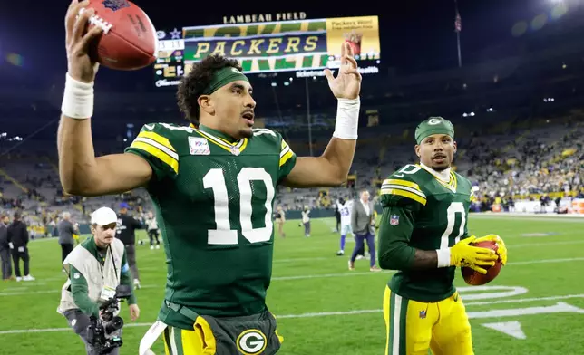 Green Bay Packers' Jordan Love and Matthew Golden celebrate after an NFL football game against the Dallas Cowboys in Green Bay, Wis., Sunday, Oct. 18, 2026. (AP Photo/Matt Ludtke)