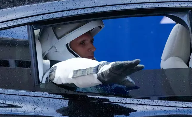 Astronaut Joshua Kutryk, of Canada, waves as he leaves the Operations and Checkout Building at the Kennedy Space Center in Cape Canaveral, Fla., Thursday, Oct. 1, 2026. (AP Photo/John Raoux)