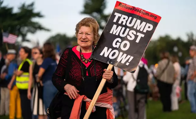 Demonstrators gather at Memorial Circle to protest the proposed Triumphal Arch, Thursday, Oct. 1, 2026, in Arlington, Va. (AP Photo/Allison Robbert)