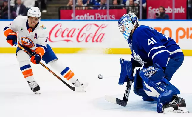 Toronto Maple Leafs goaltender Anthony Stolarz (41) stops New York Islanders' Brayden Schenn (10) during the first period of an NHL hockey game in Toronto, Wednesday, Sept. 30, 2026. (Frank Gunn/The Canadian Press via AP)
