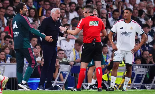 Real Madrid's head coach Jose Mourinho argues with a referee during the La Liga soccer match between Real Madrid and Villarreal in Madrid, Spain, Saturday, Oct. 10, 2026. (AP Photo/Manu Fernandez)