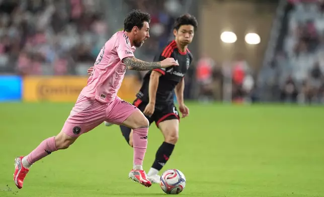 Inter Miami forward Lionel Messi drives past D.C. United defender Keisuke Kurokawa on his way to scoring his side's third goal during the second half of an MLS soccer match, Saturday, Oct. 10, 2026, in Miami. (AP Photo/Rebecca Blackwell)