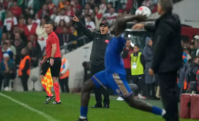 Turkey's head coach Vincenzo Montella, centre, gestures during the UEFA Nations League soccer match between Turkey and Italy in Bursa, Turkey, Monday, Sept. 28, 2026. (AP Photo/Khalil Hamra)