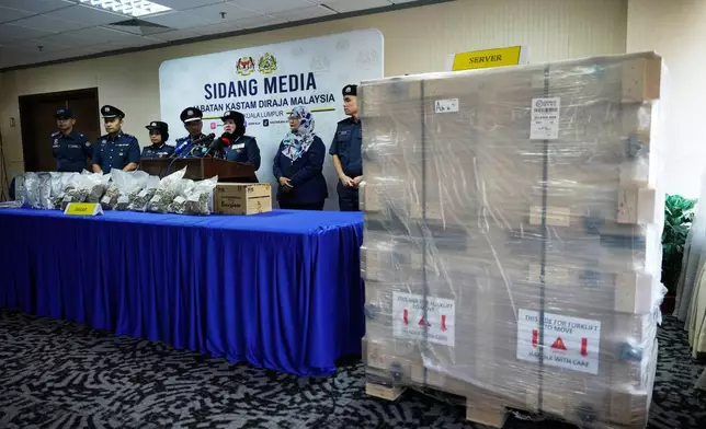 Crates containing seized servers with advanced artificial intelligence chips are displayed during a press conference at customs department headquarters in Sepang, Malaysia, Wednesday, Oct. 28, 2026. (AP Photo/Vincent Thian)