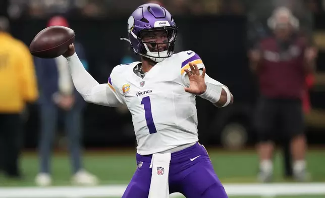 Minnesota Vikings quarterback Kyler Murray (1) passes against the New Orleans Saints during the first half of an NFL football game in New Orleans, Sunday, Oct. 11, 2026. (AP Photo/Matthew Hinton)