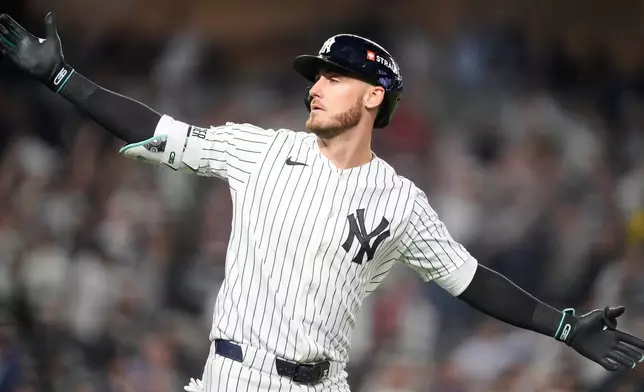 New York Yankees' Cody Bellinger reacts while jogging the bases after hitting a three-run home run against the Boston Red Sox during the sixth inningin Game 2 of baseball's American League Wild Card Series, Wednesday, Sept. 30, 2026, in New York. (AP Photo/Yuki Iwamura)