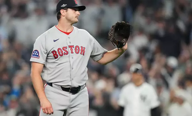 Boston Red Sox relief pitcher Garrett Whitlock reacts after giving up a three-run home run to New York Yankees' Cody Bellinger during the sixth inning in Game 2 of baseball's American League Wild Card Series, Wednesday, Sept. 30, 2026, in New York. (AP Photo/Frank Franklin II)