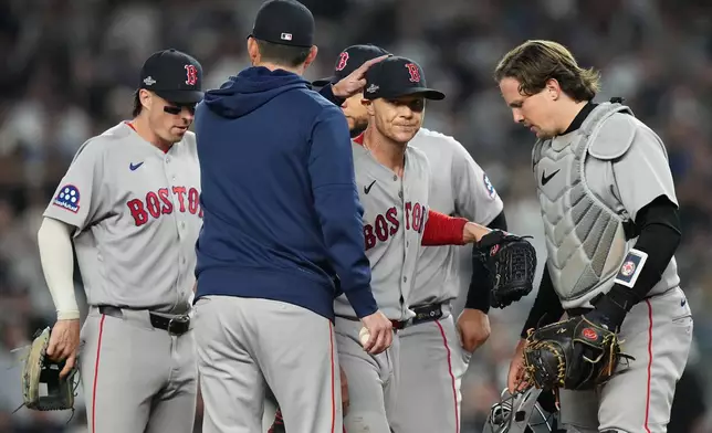 Boston Red Sox starting pitcher Sonny Gray, center facing, is pulled from the game against the New York Yankees during the fifth inning in Game 2 of baseball's American League Wild Card Series, Wednesday, Sept. 30, 2026, in New York. (AP Photo/Frank Franklin II)