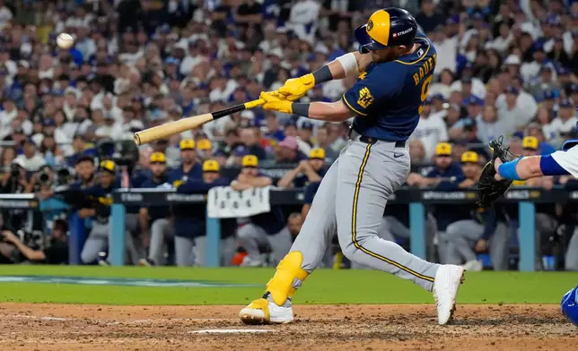 Milwaukee Brewers first baseman Jake Bauers connects for a two run home run during the seventh inning of Game 3 of baseball's National League Championship Series between the Milwaukee Brewers and the Los Angeles Dodgers, Wednesday, Oct. 14, 2026, in Los Angeles. (AP Photo/Ashley Landis)