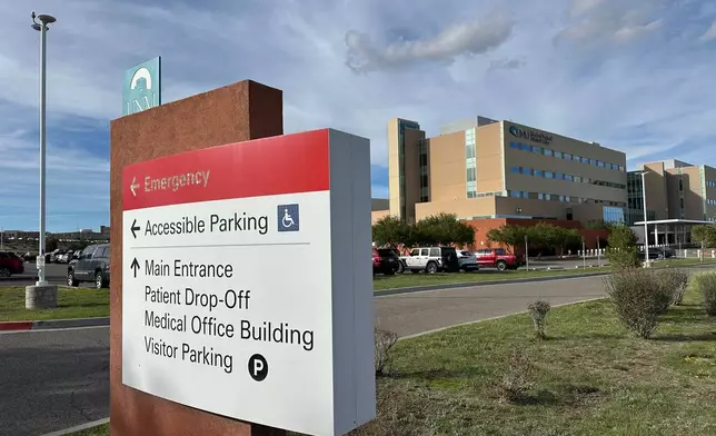 In this photo taken with a smartphone, a sign directs visitors at the UNM Sandoval Regional Medical Center in Rio Rancho, N.M., on Monday, Oct. 26, 2026. (AP Photo/Susan Montoya Bryan)