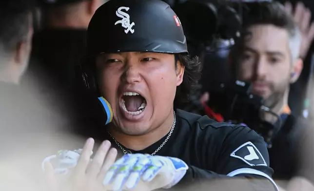 Chicago White Sox's Munetaka Murakami celebrates in the dugout after hitting a two-run home run against the Cleveland Guardians during the fourth inning in Game 1 of baseball's American League Division Series, Saturday, Oct. 3, 2026, in Cleveland. (AP Photo/Phil Long)