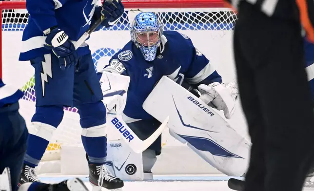 Tampa Bay Lightning goaltender Andrei Vasilevskiy (88) makes a save during the second period of an NHL hockey game against the Washington Capitals Saturday, Oct. 3, 2026, in Tampa, Fla. (AP Photo/Jason Behnken)