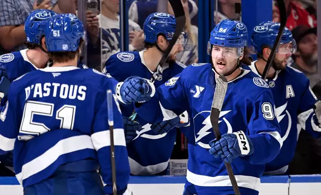 Tampa Bay Lightning center Conor Geekie (94) celebrates after his first period goal during an NHL hockey game against the Washington Capitals, Saturday, Oct. 3, 2026, in Tampa, Fla. (AP Photo/Jason Behnken)