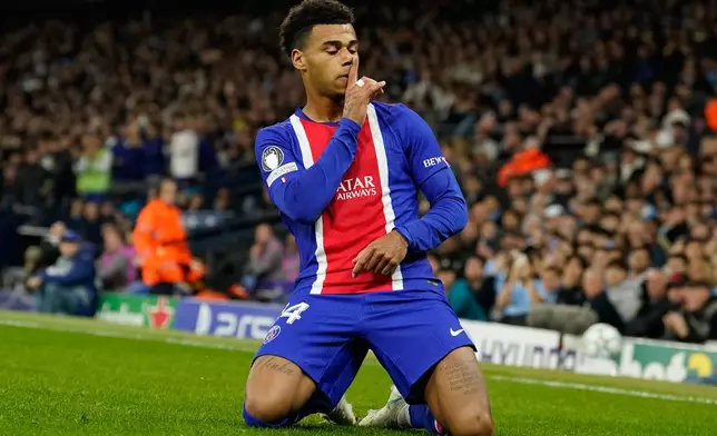 PSG's Desire Doue celebrates after scoring his side's opening goal during the Champions League opening phase soccer match between Manchester City and Paris Saint-Germain in Manchester, England, Wednesday, Oct. 14, 2026. (AP Photo/Dave Thompson)