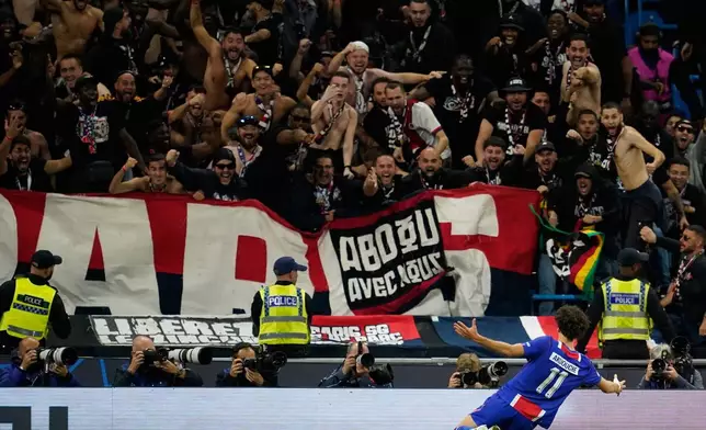 PSG's Maghnes Akliouche celebrates after scoring his side's fourth goal during the Champions League opening phase soccer match between Manchester City and Paris Saint-Germain in Manchester, England, Wednesday, Oct. 14, 2026. (AP Photo/Dave Thompson)