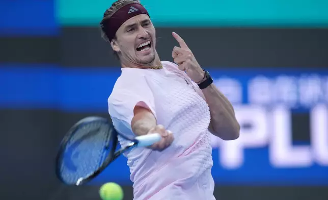Alexander Zverev, of Germany, returns a ball to Novak Djokovic, of Serbia, during the men's singles quarterfinals match at the China Open tennis tournament in Beijing, Sunday, Oct. 4, 2026. (AP Photo/Achmad Ibrahim)