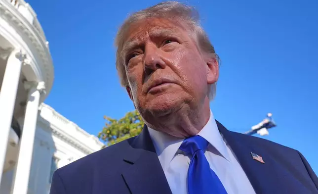President Donald Trump speaks to reporters before walking to board Marine One on the South Lawn of the White House in Washington, Thursday, Oct. 22, 2026. (AP Photo/J. Scott Applewhite)