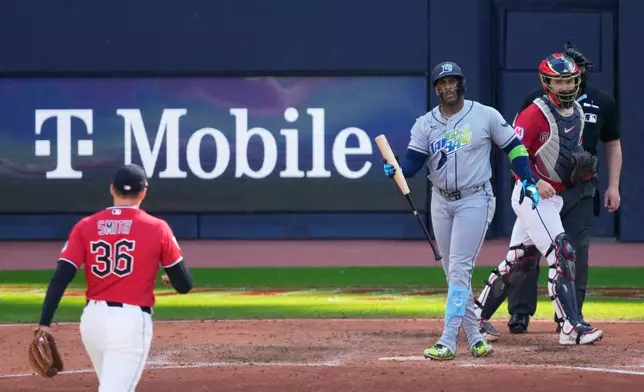Cleveland Guardians pitcher Cade Smith strikes out Tampa Bay Rays' Yandy Díaz during the eighth inning in Game 3 of an American League Championship Series baseball game in Cleveland, Thursday, Oct. 15, 2026. (AP Photo/Sue Ogrocki)